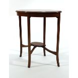 An Edwardian mahogany and strung two tier occasional table of oval form, w.  Wear commensurate
