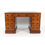 A Victorian walnut pedestal writing desk of nine drawers, w. 122 cm  Surface damaged, re-polished,