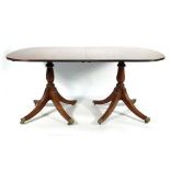 A Regency-style mahogany dining table on claw end supports, 210 x 99 cm with fitted leaf Wear