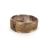 A silver bark design cuff-type bracelet,