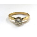 An 18ct yellow gold ring set single diamond in a raised openwork setting, diamond approx. 0.5 carat,