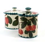 Two Wemyss covered containers both decorated with branches of  fruiting plums, max h. 11.5 cm