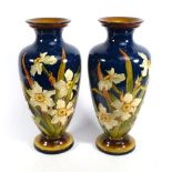 A pair of Doulton Lambeth Faience vases by Euphemia A. Thatcher of ovoid form, each painted with a