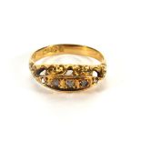 An 18ct yellow gold ring set five gradua