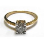 A 9ct yellow gold ring set single diamond in a four claw setting, diamond approx. 0.5 carats, ring