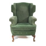 A 19th century fully upholstered wingback armchair on beech pad feet CONDITION REPORT: Some wear and