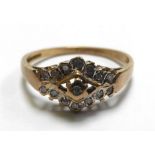 A 9ct yellow gold ring set small diamond