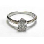 An 18ct white gold ring set oval diamond in a four claw setting, diamond approx. 0.6 carat, ring