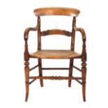 A beech open armchair with caned seat and turned splayed legs CONDITION REPORT: Normal wear,