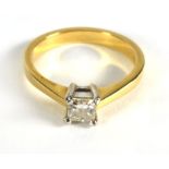 An 18ct yellow gold ring set single prin