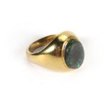 An 18ct yellow gold signet ring set a single dark opal, 8.1 gms, ring size K/L CONDITION REPORT: