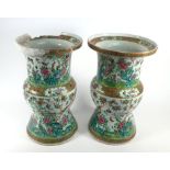 A pair of Cantonese famille verte vases of waisted form decorated in coloured enamels with exotic