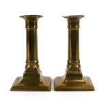 A pair of 19th century brass ejector candlesticks, h. 15 cm CONDITION REPORT: Mechanism soldered,