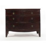A George-III mahogany bow fronted chest of two short and two long graduated drawers on bracket feet,