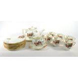 A Royal Doulton Art Deco tea service decorated with floral sprays on a white ground CONDITION