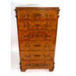 A 19th century Continental figured walnut chest of six drawers with moulded and canted corners on