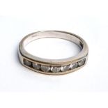 An 18ct white gold ring set seven small