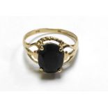 A 9ct yellow gold ring set dark oval sap