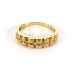 An 18ct yellow matt gold ring set three