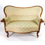 A 19th century walnut and upholstered high backed sofa with scrolled arms on splayed legs and pad
