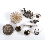 A Victorian silver memory brooch of target design, five further silver brooches, a silver ring and a