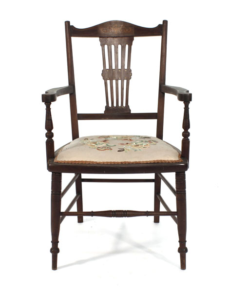 A 19th century beech and inlaid parlour armchair on turned tapering supports CONDITION REPORT: