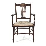 A 19th century beech and inlaid parlour armchair on turned tapering supports CONDITION REPORT: