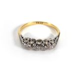 An 18ct yellow gold ring set five gradua