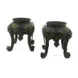 A pair of Chinese brown patinated bronze stands of koro shaped form, h. 13.5 cm CONDITION REPORT: