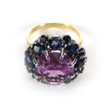 An 18ct yellow gold cocktail ring set centrally with a synthetic alexandrite within a surround of