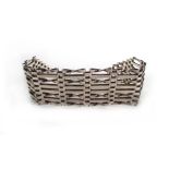 A silver eight bar gatelink bracelet wit