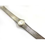 A 9ct white gold ladies 'Incabloc' wristwatch by Renown, the circular silver dial with baton