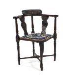 A Victorian carved oak corner chair on one cabriole and three turned legs CONDITION REPORT: Wear