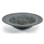 A Wedgwood black basalt shallow bowl, typically decorated with fruiting vines, d. 35 cm and a