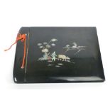 A mid-20th century black lacquer and mother of pearl inlaid photograph album, 25 x 34 cm CONDITION