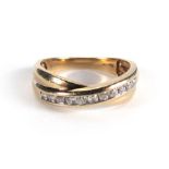 A 9ct yellow gold crossover ring set ele