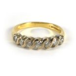 An 18ct yellow gold ring set seven diamo