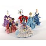 Five Royal Doulton figures consisting, HN1731 'Day Dreams', HN2335 'Hilary', HN2059 'The Bedtime