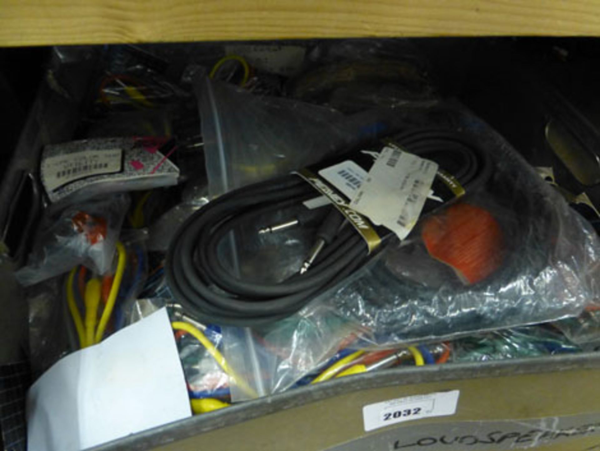 Box containing mixed cables mostly by Peavey