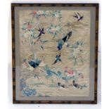 A 19th century Chinese embroidered silk panel depicting exotic birds by a blossoming tree, 49 x 38