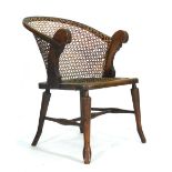 A Victorian beech and bergere armchair CONDITION REPORT: Heavy wear but structurally sound