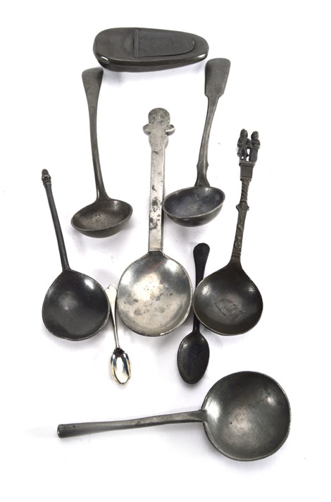 A 19th century pewter physic (or medicine) spoon together with a group of eight other pewter spoons