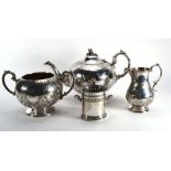 A 19th century silver plated three piece tea service, the teapot with acorn finial above an engraved