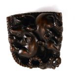 A carved hardwood netsuke modelled as a basket of three rats, l. 5 cm, signed with bone insert verso