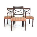A set of six Regency mahogany dining chairs on reeded tapering legs together with a matching