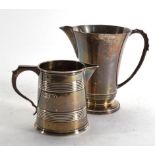 A silver milk jug of flared form, Deakin & Francis, Birmingham 1939, h. 10 cm and a Victorian silver