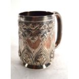 A Victorian silver repousse decorated christening mug, Josiah Williams & Co., London 1893, h. 10 cm,
