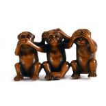 A fruitwood carving in the form of the three wise monkeys, w. 5.5 cm, signed CONDITION REPORT: Minor