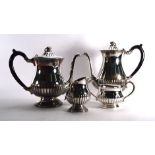 A silver plated four piece tea service of slender baluster form CONDITION REPORT: Handle broken on