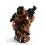 A carved fruitwood netsuke in the form of a skull, h. 4 cm, signed and two others CONDITION